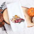 A personalized fall tea towel printed with a fall red truck with pumpkins and the family name underneath.  This can be used as a hand towel, kitchen towel, decorative towel, bathrooom towel, and more.