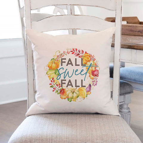 Fall linen pillow cover with text that says fall sweet fall inside of a pumpkin and gourd wreath.  Modern farmhouse style pillow cover home decor.