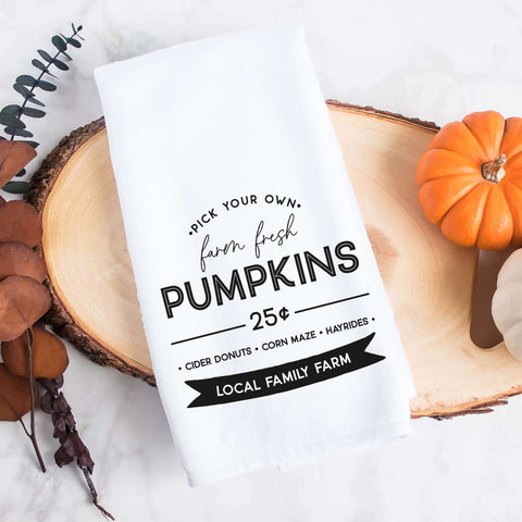 Personalized white kitchen tea towel printed with farm fresh pumpkins and a family last name.  Personalized Decorative Towel printed with the text farm fresh pumpkins.