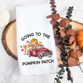 white kitchen tea towel printed with going to the pumpkin patch and a fall red truck with pumpkins.  Decorative Towel printed with the text going to the pumpkin patch