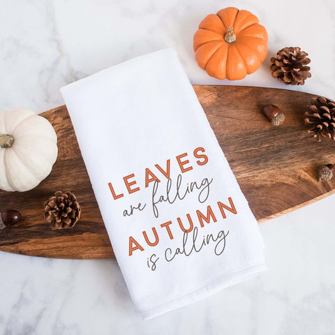 A fall tea towel printed with leaves are falling autumn is calling.  This can be used as a hand towel, kitchen towel, decorative towel, bathrooom towel, and more.