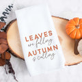 A fall tea towel printed with leaves are falling autumn is calling.  This can be used as a hand towel, kitchen towel, decorative towel, bathrooom towel, and more.