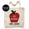 Personalized teacher canvas tote bag with #1 teacher in a red apple.