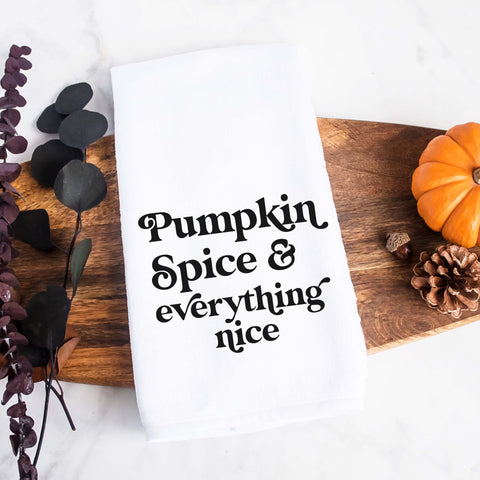 White kitchen tea towel printed with pumpkin spice and everything nice.  Decorative Towel printed with the text pumpkin spice and everything nice.
