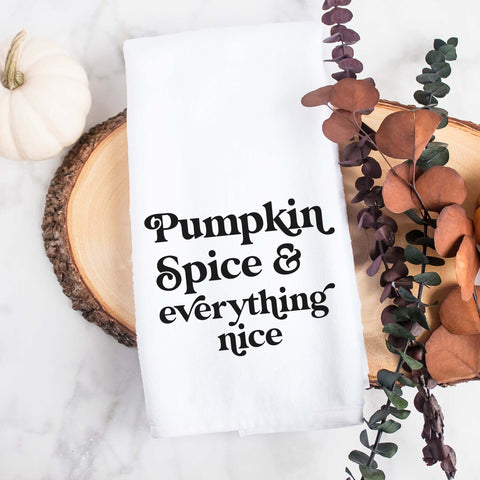 White kitchen tea towel printed with pumpkin spice and everything nice.  Decorative Towel printed with the text pumpkin spice and everything nice.