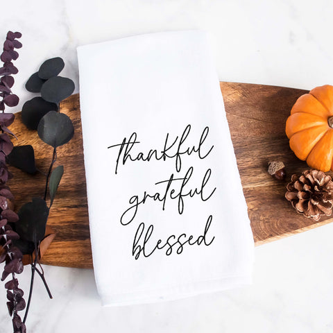 white kitchen tea towel printed with thankful grateful blessed.  Decorative Towel printed with the text thankful grateful blessed.