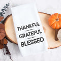 white kitchen tea towel printed with thankful grateful blessed.  Decorative Towel printed with the text thankful grateful blessed.