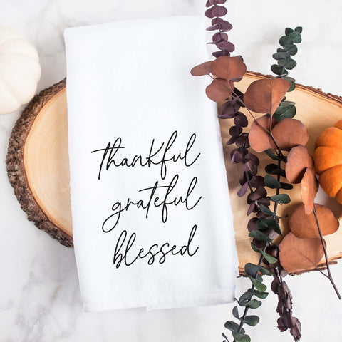 white kitchen tea towel printed with thankful grateful blessed.  Decorative Towel printed with the text thankful grateful blessed.