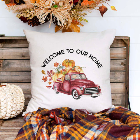 Personalized fall linen pillow cover with text that says welcome to our home and a family name with a fall red truck and pumpkins.  Modern farmhouse style pillow cover home decor.