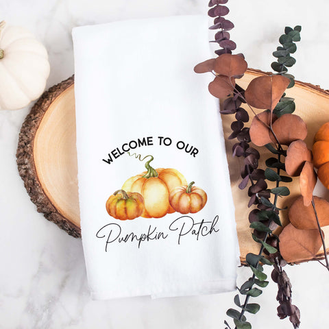 Personalized white kitchen tea towel printed with welcome to our pumpkin patch and a family last name.  Personalized Decorative Towel printed with the text wecome to our pumpkin patch.
