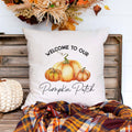 Personalized fall linen pillow cover with text that says welcome to our pumpkin patch and the family name with a pumpkin in the center.  Modern farmhouse style pillow cover home decor.