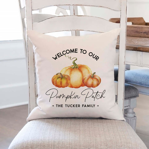 Personalized fall linen pillow cover with text that says welcome to our pumpkin patch and the family name with a pumpkin in the center.  Modern farmhouse style pillow cover home decor.