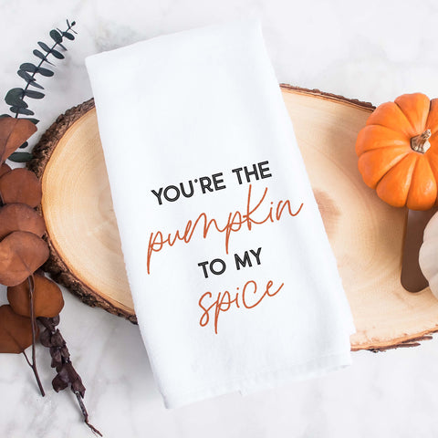 White kitchen tea towel printed with you're the pumpkin to my spice.  Decorative Towel printed with the text you're the pumpkin to my spice.